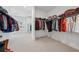 Spacious walk-in closet with custom shelving and plenty of room for storage at 7560 Wild Violet Dr, Cumming, GA 30040
