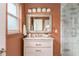 Modern bathroom with a glass-enclosed shower, marble tile, and stylish vanity, offering a luxurious space at 1613 Westwood Sw Ave, Atlanta, GA 30310