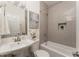 Cozy bathroom with tub and shower, stylish mirror, and neutral decor, offering a functional and relaxing space at 1613 Westwood Sw Ave, Atlanta, GA 30310