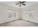 Spacious bedroom with large windows, neutral carpet, and plenty of natural light, creating a peaceful atmosphere at 1613 Westwood Sw Ave, Atlanta, GA 30310