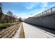 Walkway and path in a neighborhood featuring a lush park and tree-lined streetscape under a bright sky at 1613 Westwood Sw Ave, Atlanta, GA 30310