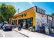 Exterior view of a yellow Thrifttown building with signage and street-side parking at 1613 Westwood Sw Ave, Atlanta, GA 30310