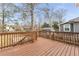 Exterior view of a well-maintained wooden deck with railing, overlooking the backyard and neighboring properties at 1613 Westwood Sw Ave, Atlanta, GA 30310