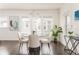 Well-lit dining room showcasing a round table, elegant chairs, and stylish decor at 1613 Westwood Sw Ave, Atlanta, GA 30310