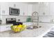 Close-up of the granite island and sink area in a bright modern kitchen at 1613 Westwood Sw Ave, Atlanta, GA 30310