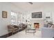 Inviting living room boasting natural light, a cozy fireplace, and stylish furniture at 1613 Westwood Sw Ave, Atlanta, GA 30310