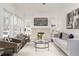 Elegant living room with a brick fireplace, built-in shelving, and chic decor at 1613 Westwood Sw Ave, Atlanta, GA 30310