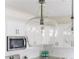 Glass pendant light over a kitchen island, providing bright and stylish illumination at 1613 Westwood Sw Ave, Atlanta, GA 30310