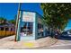 Exterior view of FIREWALL restaurant, a blue brick building, featuring large windows, outdoor seating, and neighborhood charm at 1613 Westwood Sw Ave, Atlanta, GA 30310