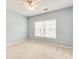 Bedroom with carpet, window, ceiling fan, and light blue walls at 215 Aldridge Pl # 9, Smyrna, GA 30082