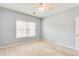 Bedroom featuring carpet, ceiling fan, window, and blue walls at 215 Aldridge Pl # 9, Smyrna, GA 30082