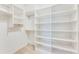 A well-organized walk-in closet with multiple shelves and hanging rods at 215 Aldridge Pl # 9, Smyrna, GA 30082