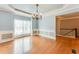 Light and airy dining room with hardwood floors, a chandelier, and elegant moldings at 215 Aldridge Pl # 9, Smyrna, GA 30082