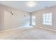 Carpeted Living Room with a window and access to the porch at 215 Aldridge Pl # 9, Smyrna, GA 30082