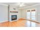 Bright living room with white-brick fireplace, wood mantel, and access to an outdoor deck at 215 Aldridge Pl # 9, Smyrna, GA 30082