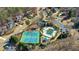 A high angle aerial view of a community pool and tennis courts surrounded by homes at 3493 Maryhill Nw Ln, Kennesaw, GA 30152