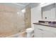 Bathroom featuring a walk-in shower with tile surround and a vanity with granite countertop at 3493 Maryhill Nw Ln, Kennesaw, GA 30152