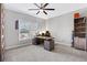 Neutral bedroom with carpet, ceiling fan, and a wooden desk at 3493 Maryhill Nw Ln, Kennesaw, GA 30152