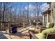 Outdoor deck with seating and dining areas that overlook the trees, offering a peaceful retreat at 3493 Maryhill Nw Ln, Kennesaw, GA 30152