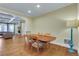 Open dining area with hardwood floors leading to living area with stone fireplace for relaxed entertaining at 3493 Maryhill Nw Ln, Kennesaw, GA 30152