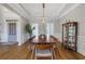 Formal dining room with hardwood floors, modern light fixture, and seating for ten at 3493 Maryhill Nw Ln, Kennesaw, GA 30152