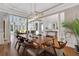 Bright dining area open to the living room, featuring large windows and stylish lighting at 3493 Maryhill Nw Ln, Kennesaw, GA 30152