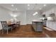 Well-equipped kitchen with island, dining area, and white cabinetry at 3493 Maryhill Nw Ln, Kennesaw, GA 30152