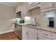 Efficient kitchenette featuring granite countertops, stainless steel appliances, and a tiled backsplash at 3493 Maryhill Nw Ln, Kennesaw, GA 30152