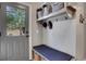 Mudroom with storage bench, hooks, and shelving, ideal for entryway organization at 3493 Maryhill Nw Ln, Kennesaw, GA 30152