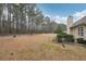 Large, private backyard with established trees and landscaping offering a serene outdoor space at 85 Windward Dr, Covington, GA 30016