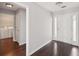 Home entrance featuring grey walls, dark floors and a glimpse into the laundry room at 85 Windward Dr, Covington, GA 30016