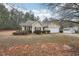 Traditional exterior of a one-story home featuring a driveway and attached two-car garage at 85 Windward Dr, Covington, GA 30016