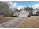 Traditional exterior of a one-story home featuring a driveway and attached two-car garage at 85 Windward Dr, Covington, GA 30016