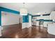 Open kitchen area with stainless steel appliances and hardwood floors at 85 Windward Dr, Covington, GA 30016