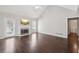 Cozy living room with vaulted ceiling, a fireplace, and a door to the outside at 85 Windward Dr, Covington, GA 30016