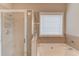 Bathroom featuring a shower and bathtub at 2479 Brynfield Cv, Suwanee, GA 30024