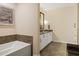 Bathroom featuring a bathtub and double vanity at 270 17Th Nw St # 1113, Atlanta, GA 30363