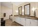 Bathroom featuring a double vanity with granite countertops and decorative mirrors at 270 17Th Nw St # 1113, Atlanta, GA 30363