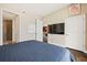 Bedroom showcasing a white board, a television set, and a view into the kitchen and bathroom at 270 17Th Nw St # 1113, Atlanta, GA 30363