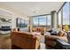 Well-lit living room with a leather sofa set and a great view of the city skyline at 270 17Th Nw St # 1113, Atlanta, GA 30363