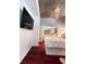 Modern bedroom with wood floors, a mirrored closet, and a decorative chandelier at 3324 Peachtree Ne Rd # 1116, Atlanta, GA 30326