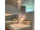 Modern bedroom featuring wood floors, mirrored closet, and a chandelier at 3324 Peachtree Ne Rd # 1116, Atlanta, GA 30326