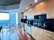 Contemporary kitchen with modern cabinetry, stainless steel appliances, and open city views at 3324 Peachtree Ne Rd # 1116, Atlanta, GA 30326