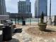 Outdoor area features an outdoor grill, and glimpses of the nearby pool at 3324 Peachtree Ne Rd # 1116, Atlanta, GA 30326