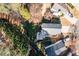 Aerial view of a house with a backyard featuring a stone patio with a grill and an outdoor dining set at 503 Stanford Pl, Woodstock, GA 30188