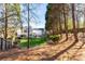 Expansive backyard featuring lush greenery, mature trees, and a patio, offering a private and serene outdoor retreat at 503 Stanford Pl, Woodstock, GA 30188