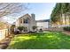 Charming backyard with a patio, pergola, and well-manicured lawn, creating a tranquil oasis for relaxation and entertainment at 503 Stanford Pl, Woodstock, GA 30188