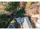 Aerial view of an enclosed backyard featuring a stone patio with grill and outdoor dining set at 503 Stanford Pl, Woodstock, GA 30188