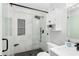 Modern bathroom with a glass-enclosed shower, black hardware, and sleek white vanity at 503 Stanford Pl, Woodstock, GA 30188