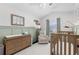 Calming Bedroom featuring soft green accents, natural wood furniture, and plenty of natural light at 503 Stanford Pl, Woodstock, GA 30188